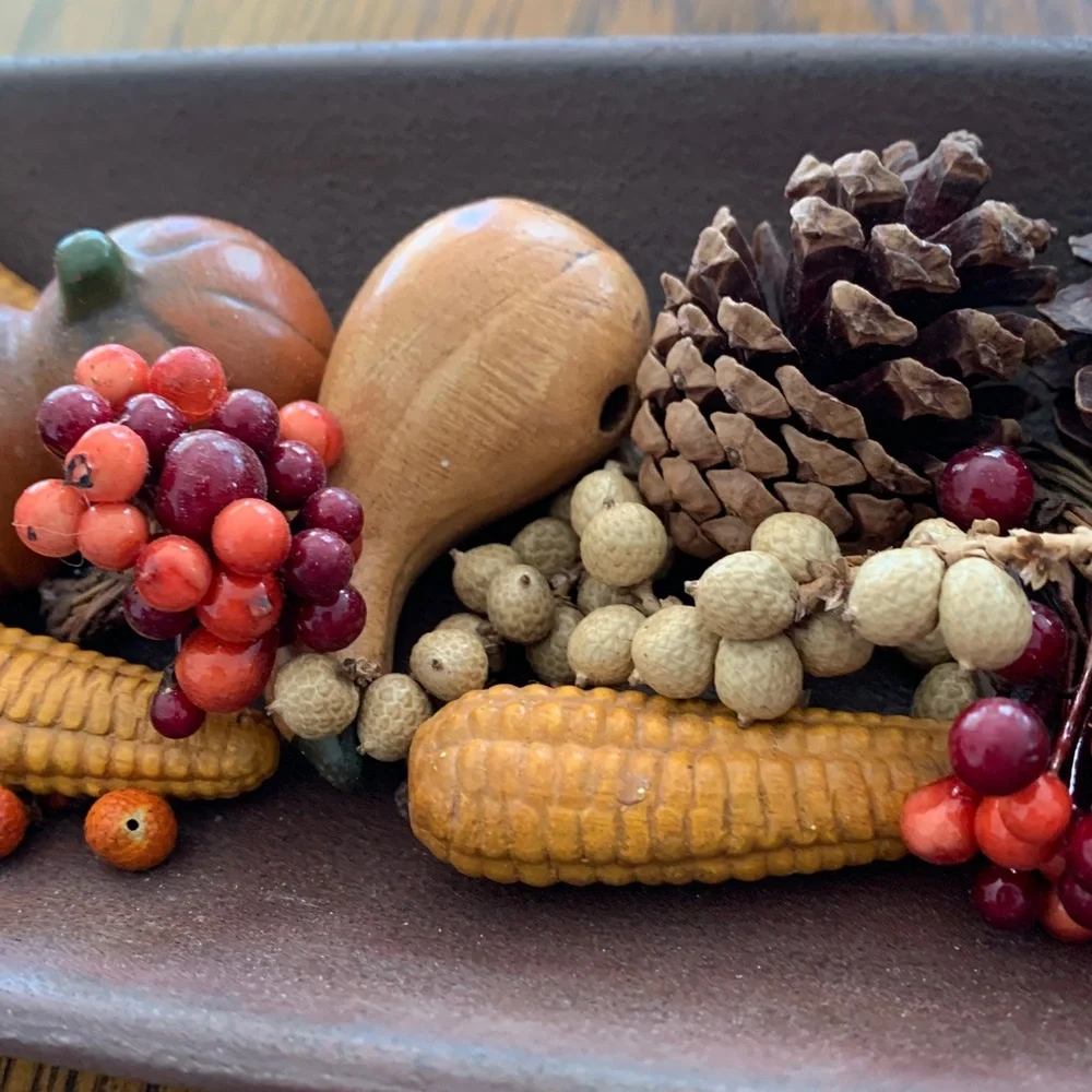Fall-Themed Decorative Centerpiece in a long shallow bowl.